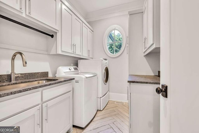 481 Meadow Lake Ter, Hoschton, GA 30548 - laundry area with separate washer and dryer, cabinet space, and crown molding