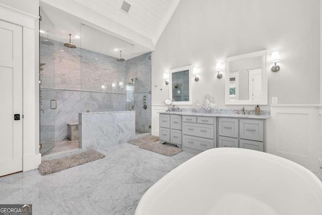 481 Meadow Lake Ter, Hoschton, GA 30548 - full bath with a stall shower, vaulted ceiling, double vanity, a freestanding bath, and marble finish floors