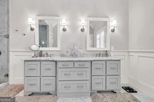 481 Meadow Lake Ter, Hoschton, GA 30548 - full bath with a decorative wall, double vanity, a wainscoted wall, a shower with door, and marble finish floors