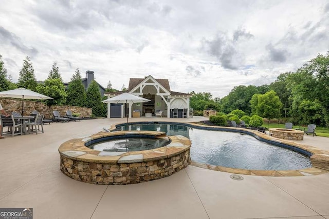 481 Meadow Lake Ter, Hoschton, GA 30548 - view of pool featuring a fire pit, a pool with connected hot tub, and a patio area