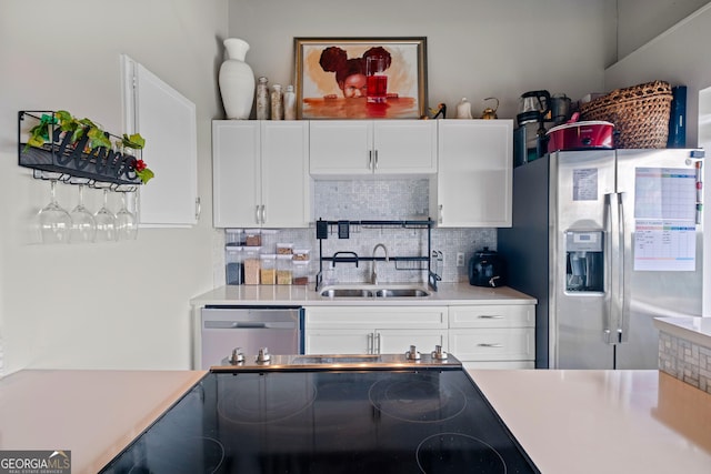 120 Ralph Mcgill Blvd NE Apt 1409, Atlanta, GA 30308 - kitchen featuring stainless steel appliances, light countertops, decorative backsplash, and white cabinets