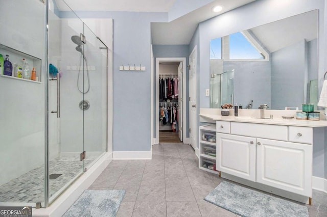 2275 Holly Run Dr, Jonesboro, GA 30236 - full bath with vanity, a stall shower, a spacious closet, and recessed lighting