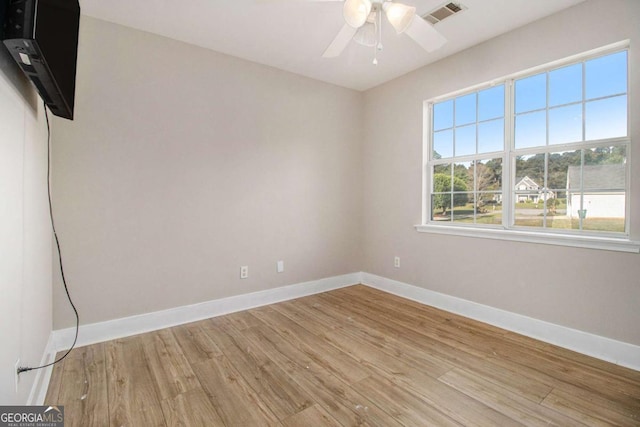 2275 Holly Run Dr, Jonesboro, GA 30236 - spare room with light wood-style flooring and ceiling fan