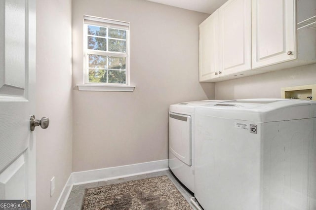 2275 Holly Run Dr, Jonesboro, GA 30236 - laundry room featuring washing machine and clothes dryer and cabinet space