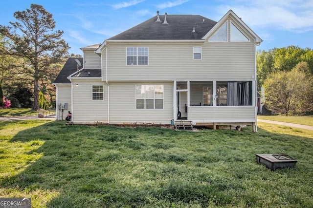 2275 Holly Run Dr, Jonesboro, GA 30236 - rear view of property with a yard, a sunroom, and a shingled roof