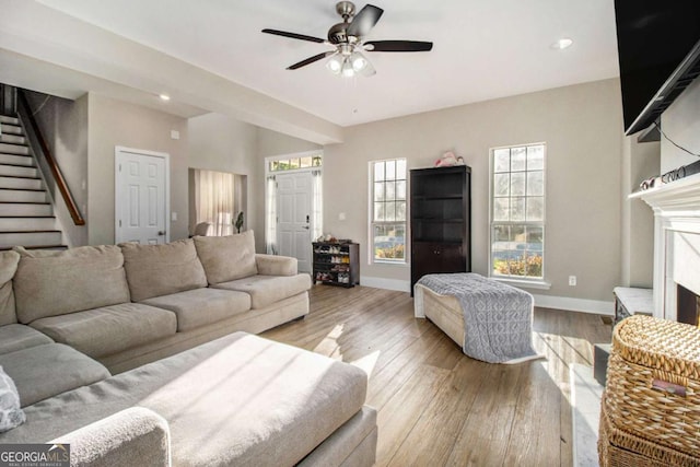 2275 Holly Run Dr, Jonesboro, GA 30236 - living room featuring stairs, ceiling fan, wood finished floors, and recessed lighting