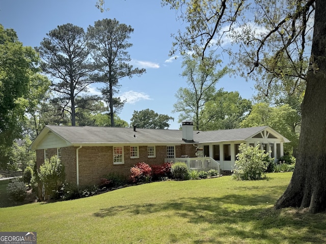 1055 E Hermitage Rd NE, Rome, GA 30161 - rear view of property with brick siding, a yard, a deck, and a chimney