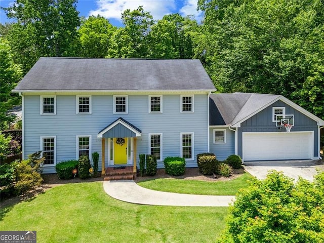 3912 Edenton Ct, Brookhaven, GA 30319 - colonial home featuring a garage, a front yard, driveway, and board and batten siding