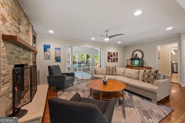 3912 Edenton Ct, Brookhaven, GA 30319 - living room with wood finished floors, recessed lighting, a ceiling fan, crown molding, and a large fireplace