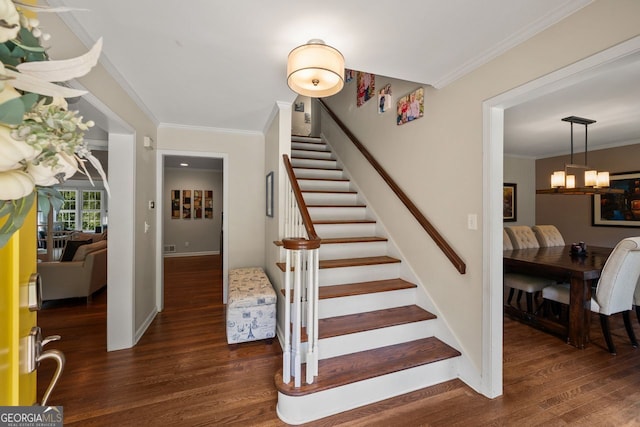 3912 Edenton Ct, Brookhaven, GA 30319 - staircase with wood finished floors, crown molding, and a chandelier