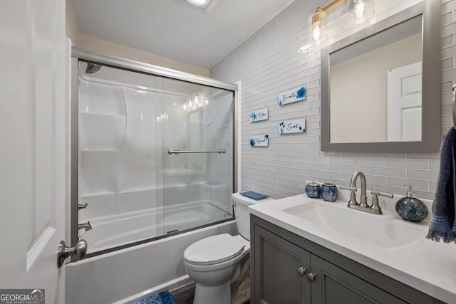 3912 Edenton Ct, Brookhaven, GA 30319 - bathroom featuring vanity, backsplash, tile walls, and bath / shower combo with glass door