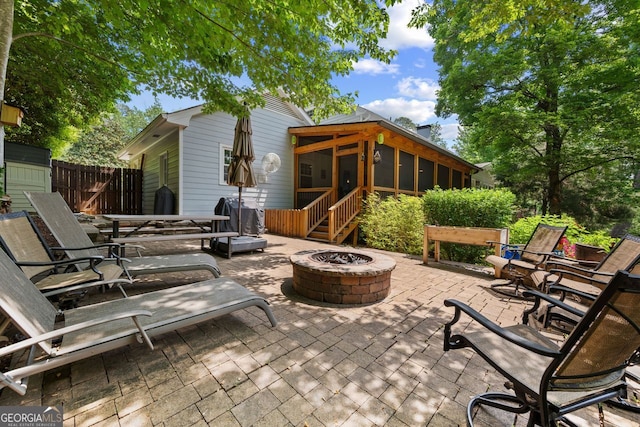 3912 Edenton Ct, Brookhaven, GA 30319 - view of patio / terrace with an outdoor fire pit and a sunroom