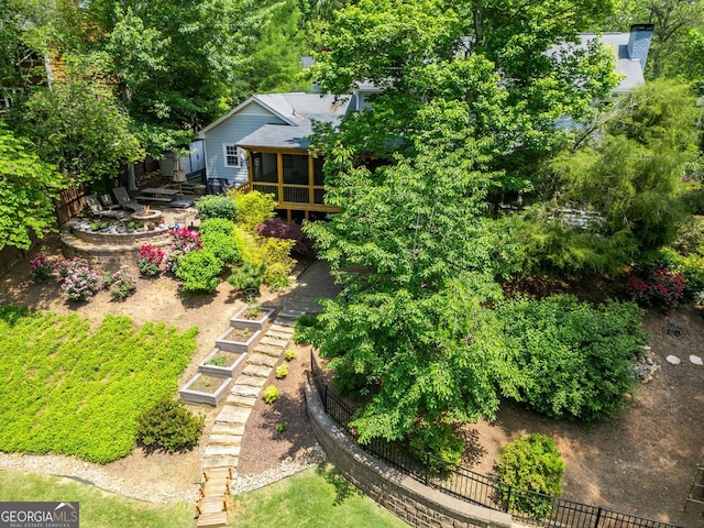 3912 Edenton Ct, Brookhaven, GA 30319 - view of yard with a vegetable garden, an outdoor fire pit, and a sunroom