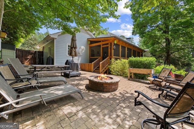 3912 Edenton Ct, Brookhaven, GA 30319 - view of patio / terrace featuring an outdoor fire pit and a sunroom
