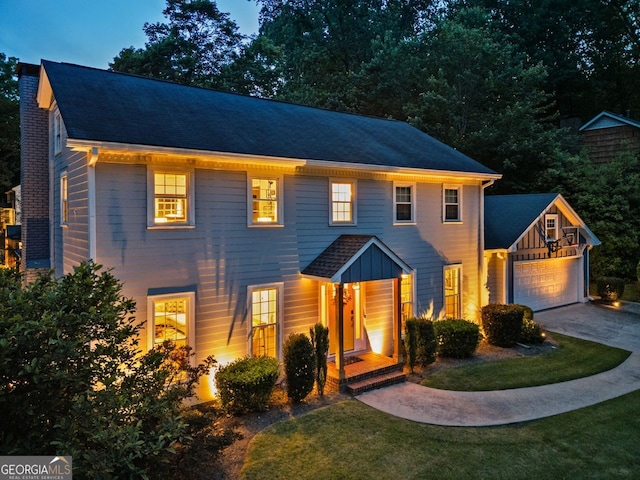 3912 Edenton Ct, Brookhaven, GA 30319 - colonial inspired home featuring concrete driveway, a garage, a front yard, and a chimney