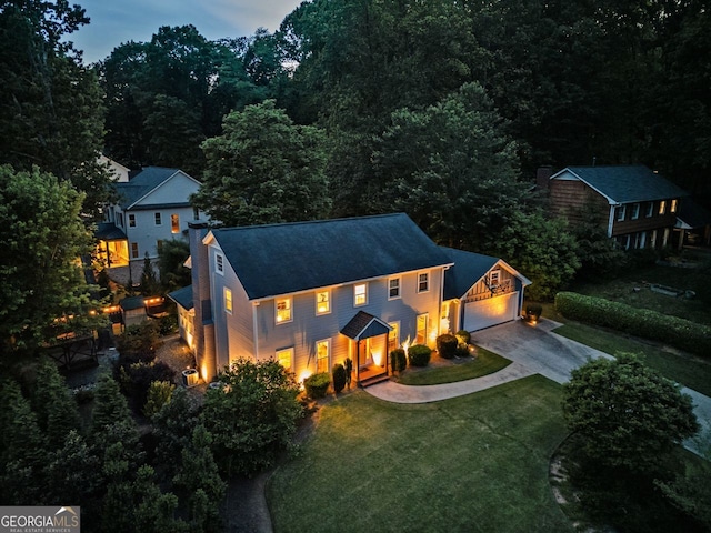 3912 Edenton Ct, Brookhaven, GA 30319 - view of front facade with a detached garage, a front yard, and a shingled roof