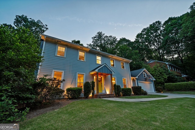 3912 Edenton Ct, Brookhaven, GA 30319 - colonial home with a garage, a front lawn, concrete driveway, and an outdoor structure
