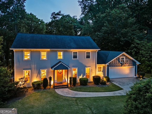 3912 Edenton Ct, Brookhaven, GA 30319 - colonial house featuring an attached garage, concrete driveway, and a front lawn