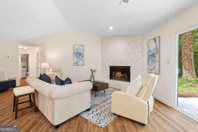 4818 Terrace Green Trce, Stone Mountain, GA 30088 - living area with wood finished floors, a fireplace, and lofted ceiling