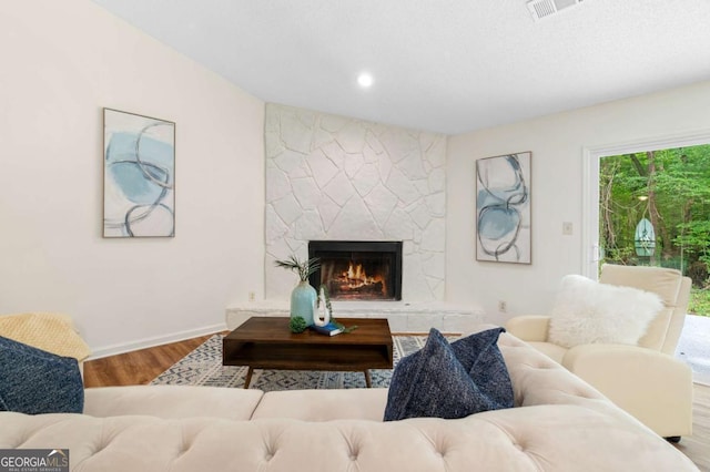 4818 Terrace Green Trce, Stone Mountain, GA 30088 - living area with wood finished floors and a stone fireplace
