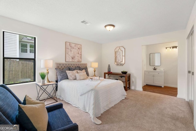 4818 Terrace Green Trce, Stone Mountain, GA 30088 - bedroom with light carpet and ensuite bathroom
