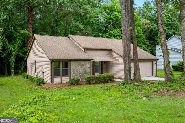 4818 Terrace Green Trce, Stone Mountain, GA 30088 - mid-century modern home with a garage, roof with shingles, and a front lawn