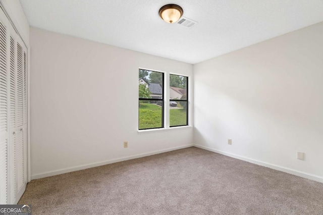 4818 Terrace Green Trce, Stone Mountain, GA 30088 - unfurnished bedroom with carpet floors and a closet