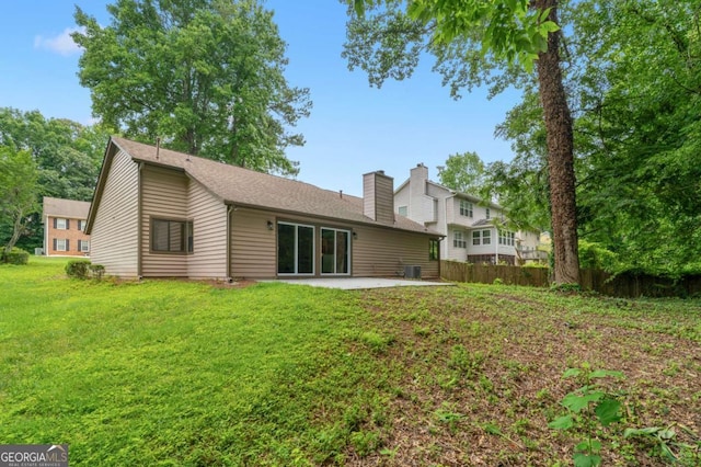 4818 Terrace Green Trce, Stone Mountain, GA 30088 - rear view of house with a patio area, a chimney, and roof with shingles