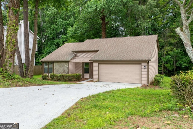 4818 Terrace Green Trce, Stone Mountain, GA 30088 - mid-century home featuring concrete driveway, an attached garage, and roof with shingles