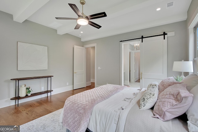 172 Forest Berry Ct Lot 100M2A, Newnan, GA 30265 - bedroom with beam ceiling, wood finished floors, a barn door, recessed lighting, and ceiling fan