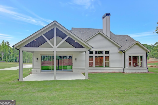 172 Forest Berry Ct Lot 100M2A, Newnan, GA 30265 - back of property with a patio area, a lawn, a shingled roof, and a chimney