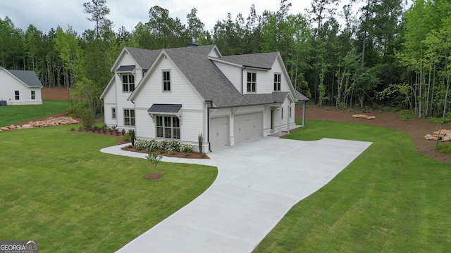172 Forest Berry Ct Lot 100M2A, Newnan, GA 30265 - modern inspired farmhouse featuring roof with shingles, an attached garage, driveway, a front lawn, and a standing seam roof