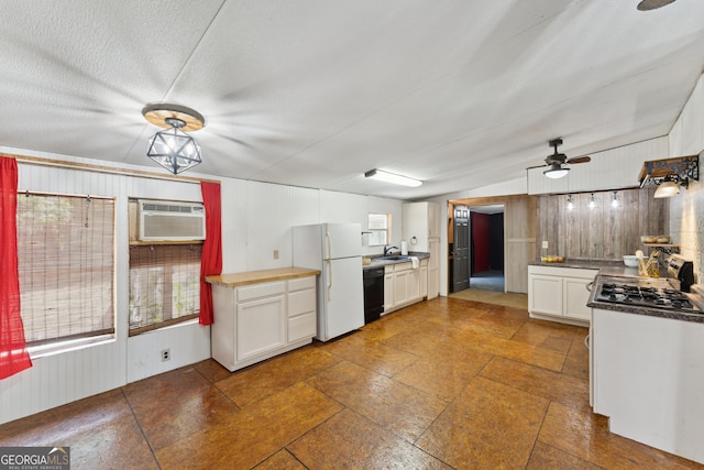 99 Conifer Dr, Guyton, GA 31312 - kitchen featuring freestanding refrigerator, dishwasher, a ceiling fan, a wall mounted air conditioner, and white cabinets