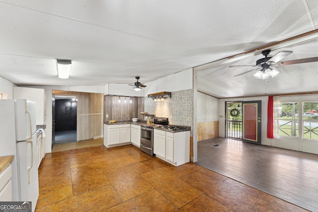 99 Conifer Dr, Guyton, GA 31312 - kitchen with stainless steel range, freestanding refrigerator, ceiling fan, white cabinets, and open floor plan
