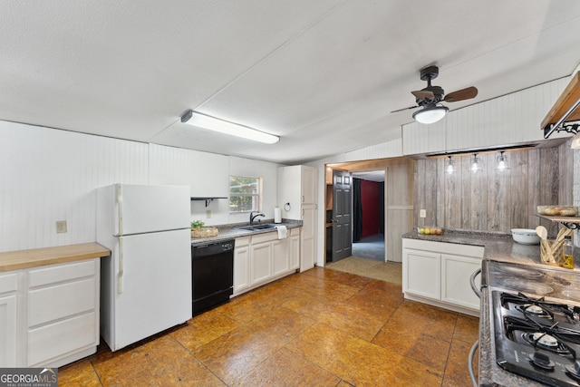 99 Conifer Dr, Guyton, GA 31312 - kitchen with stove, black dishwasher, freestanding refrigerator, white cabinetry, and a ceiling fan
