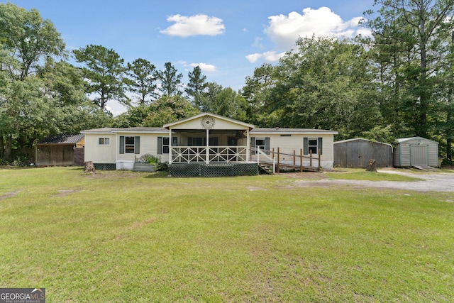 99 Conifer Dr, Guyton, GA 31312 - rear view of house featuring a shed, a lawn, and view of wooded area