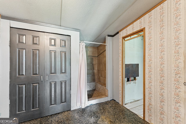 99 Conifer Dr, Guyton, GA 31312 - bathroom with a tile shower and a textured ceiling