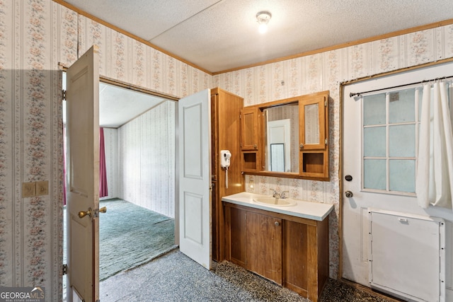 99 Conifer Dr, Guyton, GA 31312 - bathroom featuring wallpapered walls, vanity, a textured ceiling, and ornamental molding