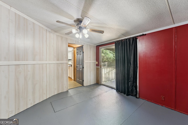 99 Conifer Dr, Guyton, GA 31312 - spare room with a ceiling fan, concrete flooring, a textured ceiling, and ornamental molding