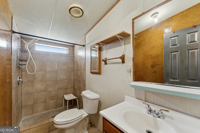 99 Conifer Dr, Guyton, GA 31312 - bathroom with a textured ceiling, tiled shower, and vanity