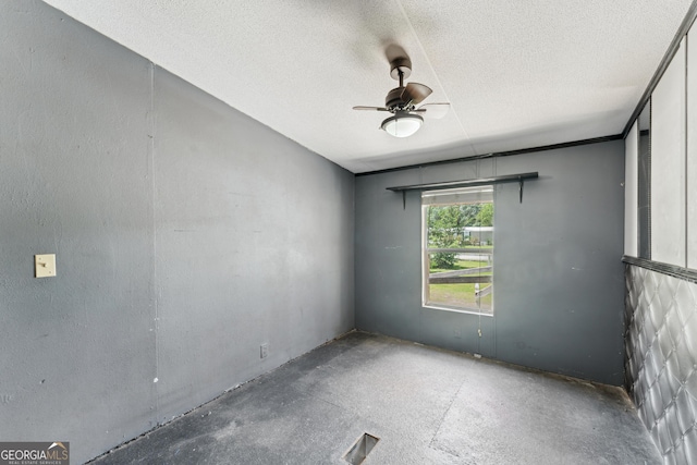 99 Conifer Dr, Guyton, GA 31312 - empty room with a ceiling fan, a textured ceiling, and concrete flooring