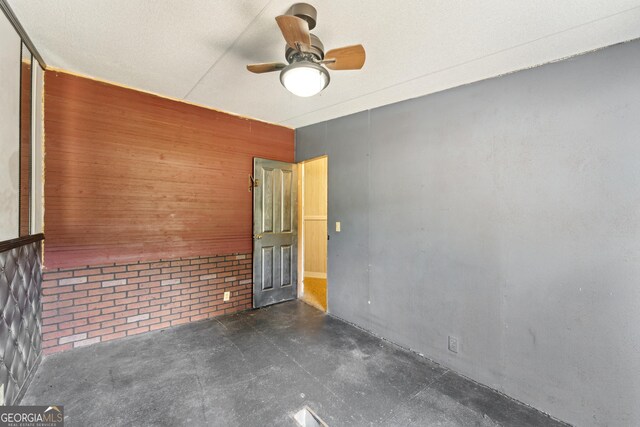 99 Conifer Dr, Guyton, GA 31312 - spare room with wooden walls and ceiling fan