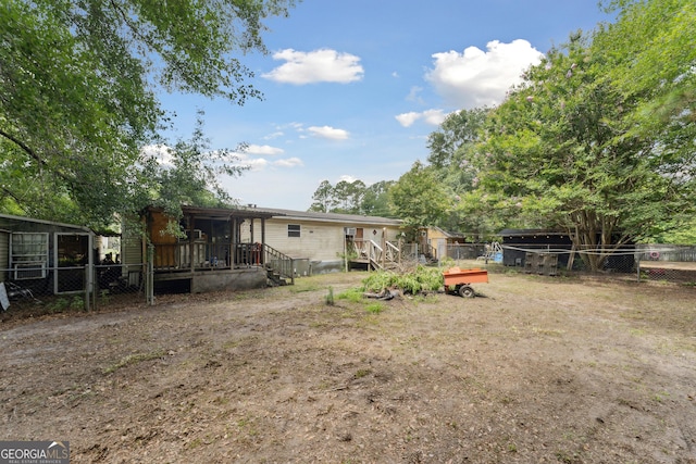 99 Conifer Dr, Guyton, GA 31312 - fenced yard with a wooden deck