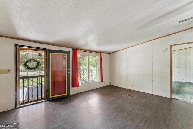 99 Conifer Dr, Guyton, GA 31312 - foyer entrance featuring a textured ceiling, wood finished floors, healthy amount of natural light, and ornamental molding