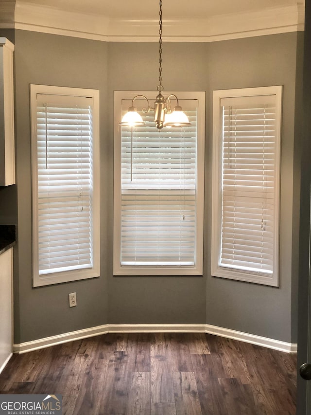 1433 Cotton Trl SW, Conyers, GA 30094 - unfurnished dining area featuring a chandelier and dark wood finished floors