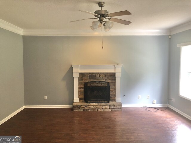 1433 Cotton Trl SW, Conyers, GA 30094 - unfurnished living room featuring wood finished floors, crown molding, a ceiling fan, healthy amount of natural light, and a fireplace