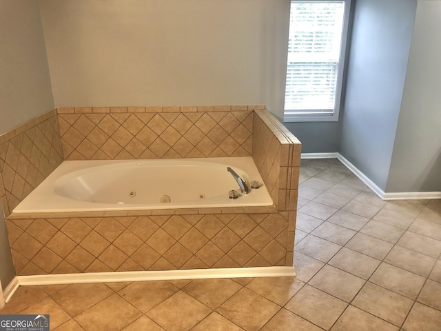1433 Cotton Trl SW, Conyers, GA 30094 - bathroom featuring tile patterned flooring and a jetted tub