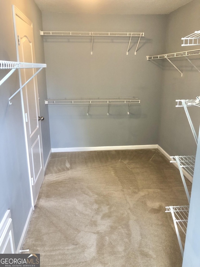 1433 Cotton Trl SW, Conyers, GA 30094 - spacious closet featuring carpet flooring