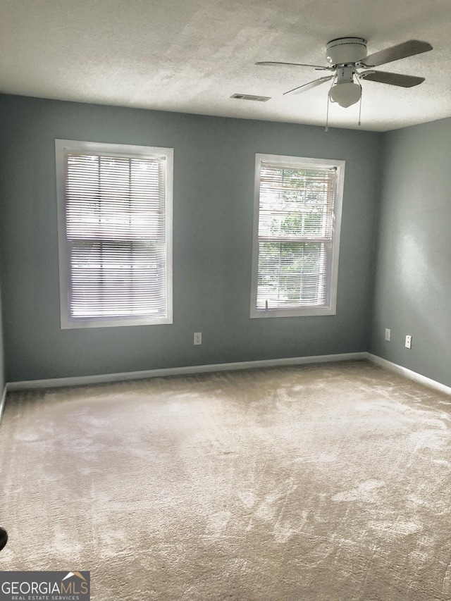 1433 Cotton Trl SW, Conyers, GA 30094 - carpeted empty room with ceiling fan and a textured ceiling