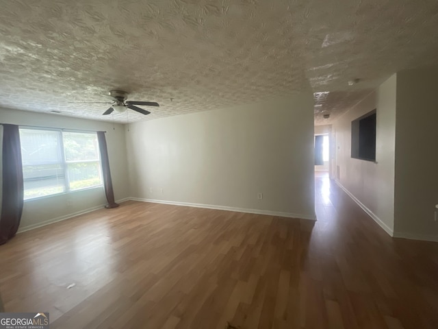 14104 Fairington Ridge Cir, Lithonia, GA 30038 - spare room featuring a ceiling fan, wood finished floors, and a textured ceiling